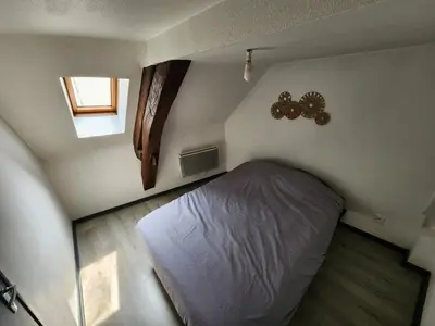 Un ou plusieurs lits dans un hébergement de l'établissement L'appartement d'Edmond Bour