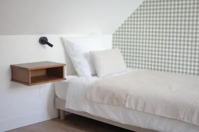 Un ou plusieurs lits dans un hébergement de l'établissement La Maison de Givry