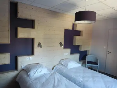 Un ou plusieurs lits dans un hébergement de l'établissement Ch d'Hôte LE BON ABRI JURA
