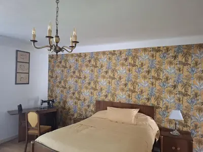 Un ou plusieurs lits dans un hébergement de l'établissement Maison de campagne avec jardin Chez nous