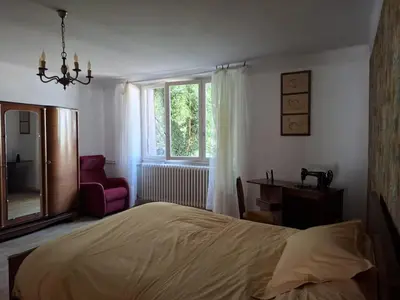 Un ou plusieurs lits dans un hébergement de l'établissement Maison de campagne avec jardin Chez nous