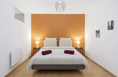 Un ou plusieurs lits dans un hébergement de l'établissement Le Prestige Mâconnais Calme Central Luxe