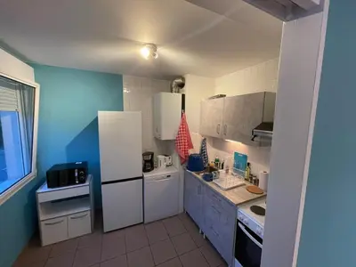 Cuisine ou kitchenette dans l'établissement Magnifique logement hyper-centre-Paray-le-Monial