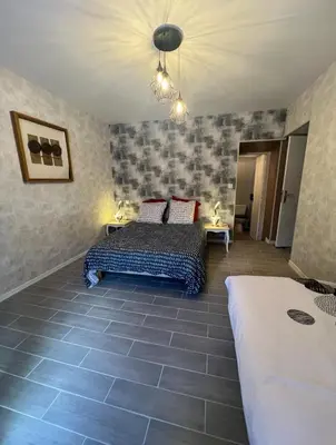 Un ou plusieurs lits dans un hébergement de l'établissement Gite la Vieille Auberge de Chaumard