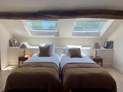 Un ou plusieurs lits dans un hébergement de l'établissement Chambre d'hôtes - Suite familiale accès privatif