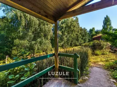 Jardin de l'établissement Gîte des fleurs - 5 Chalets