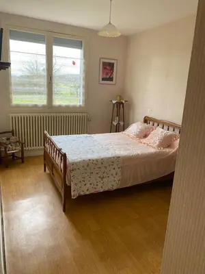 Un ou plusieurs lits dans un hébergement de l'établissement Vintage house Chez la Marcelle
