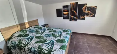 Un ou plusieurs lits dans un hébergement de l'établissement Maison plein coeur de village