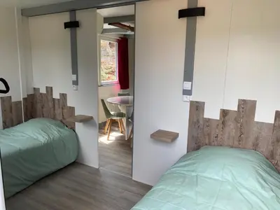 Un ou plusieurs lits dans un hébergement de l'établissement Chalet Iris