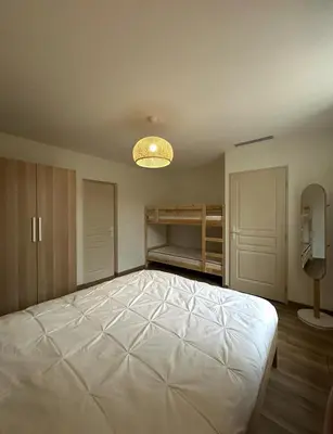 Un ou plusieurs lits dans un hébergement de l'établissement Maison rénovée - Climatisée - Paray-le-Monial - Au bois clair