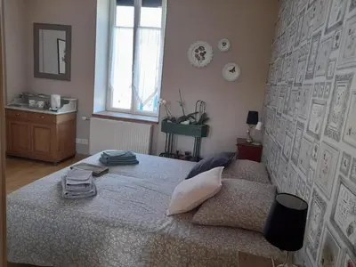 Un ou plusieurs lits dans un hébergement de l'établissement Au Jardin de Curé
