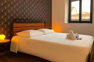 Un ou plusieurs lits dans un hébergement de l'établissement Le chic Calme - Central - Cosy