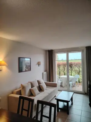 Coin salon dans l'établissement Apartment in Beaune