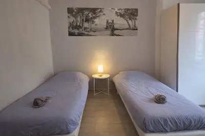 Un ou plusieurs lits dans un hébergement de l'établissement Les Fresques Mâconnaises Central - Luxe - 7pers