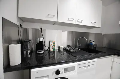 Cuisine ou kitchenette dans l'établissement Le Petit Cocon