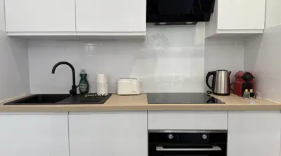 Cuisine ou kitchenette dans l'établissement Le Raffiné Central Chic Spacieux