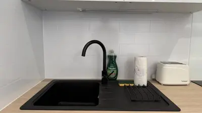 Cuisine ou kitchenette dans l'établissement Le Raffiné Central Chic Spacieux