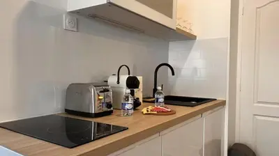 Cuisine ou kitchenette dans l'établissement Le Privilège Cosy Central Chic