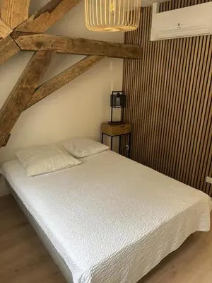 Un ou plusieurs lits dans un hébergement de l'établissement Maison des tilleuls