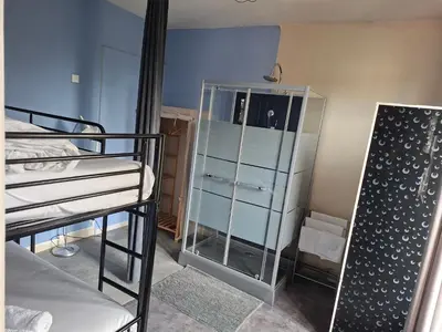 Un ou plusieurs lits dans un hébergement de l'établissement Hôtel JurJura