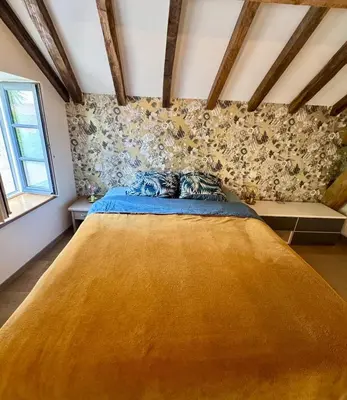 Un ou plusieurs lits dans un hébergement de l'établissement Maisonnette au cœur des vignes