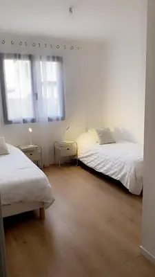 Un ou plusieurs lits dans un hébergement de l'établissement Jolie maison, plain-pied à Dole