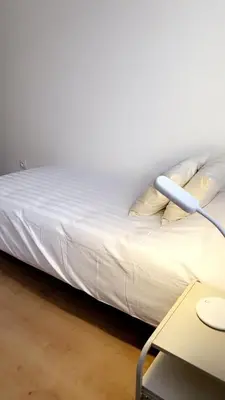 Un ou plusieurs lits dans un hébergement de l'établissement Jolie maison, plain-pied à Dole