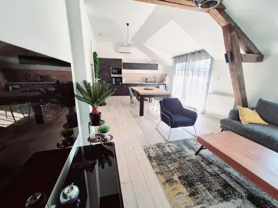 Coin salon dans l'établissement Appartement Spa et Terrasse