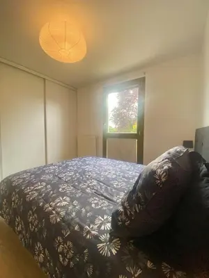 Un ou plusieurs lits dans un hébergement de l'établissement Appartement résidence piscine - Dijon quartier Toison d'Or