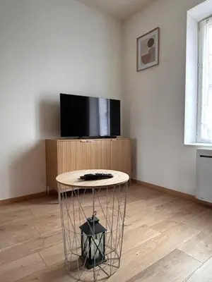 Télévision ou salle de divertissement dans l'établissement L'Appartement Assas