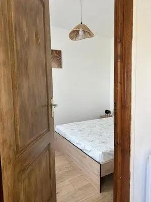 Un ou plusieurs lits dans un hébergement de l'établissement L'Appartement Assas