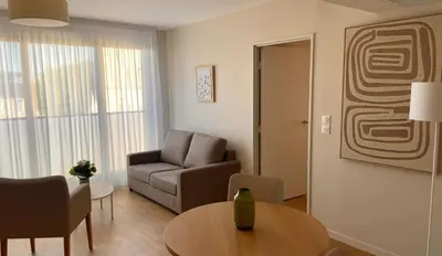 Coin salon dans l'établissement Zenao Appart'hôtels Mâcon