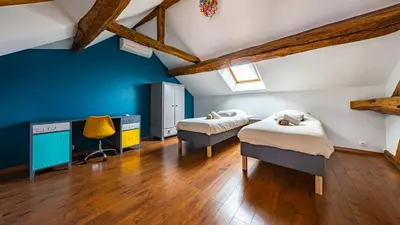 Un ou plusieurs lits dans un hébergement de l'établissement Maison ALMA Piscine -Baby Foot - Cheminée- Jacuzzi