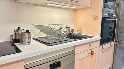 Cuisine ou kitchenette dans l'établissement Le Cosy - Place du 30 octobre - 4 personnes