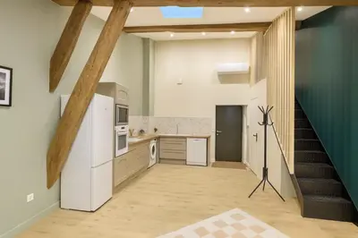 Cuisine ou kitchenette dans l'établissement L Oasis Mâconnaise d Excellence Conciergerie