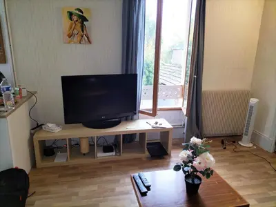 Télévision ou salle de divertissement dans l'établissement Le Majestik