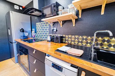 Cuisine ou kitchenette dans l'établissement Le Grand Gîte - Gites BO
