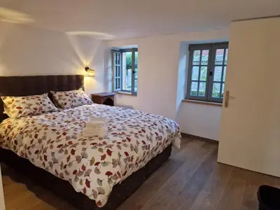 Un ou plusieurs lits dans un hébergement de l'établissement Auberge du Vieux Brancion