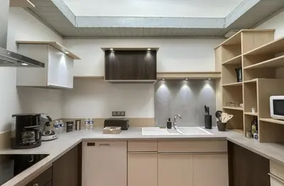 Cuisine ou kitchenette dans l'établissement Les Loges du Beaujolais Maison Chic et Confort