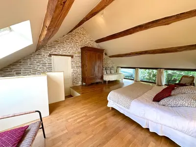 Un ou plusieurs lits dans un hébergement de l'établissement Clos de Fougères - Duplex Les Fleurières