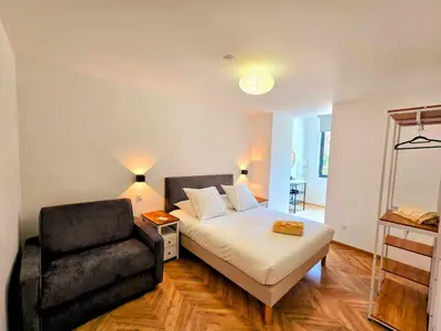 Un ou plusieurs lits dans un hébergement de l'établissement L'appartement 3 by Vindihouses