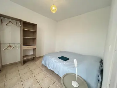 Un ou plusieurs lits dans un hébergement de l'établissement Charmant appartement T2 Parc de la Verrerie Confort