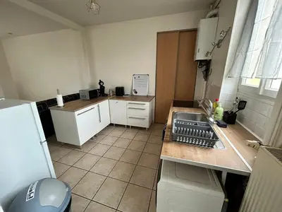 Cuisine ou kitchenette dans l'établissement Charmant appartement T2 Parc de la Verrerie Confort