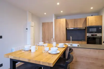 Cuisine ou kitchenette dans l'établissement Résidence le 16 - Centre Ville