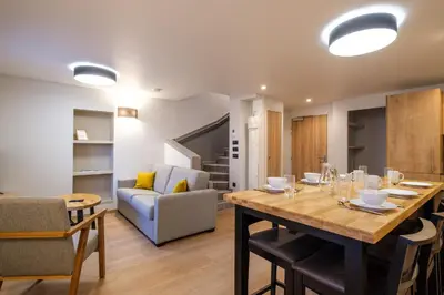 Coin salon dans l'établissement Résidence le 16 - Centre Ville