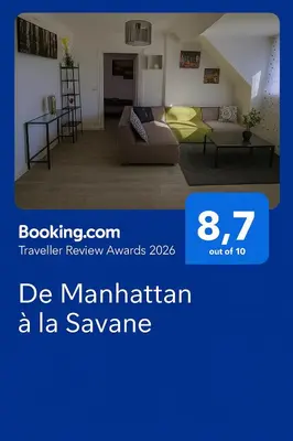 Un ou plusieurs lits dans un hébergement de l'établissement De Manhattan à la savane