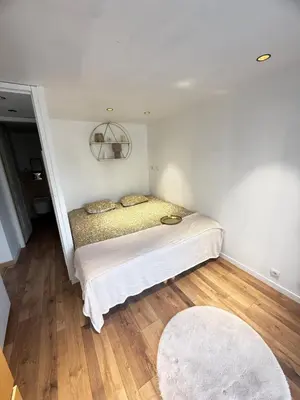 Un ou plusieurs lits dans un hébergement de l'établissement Appart cocooning terrasse