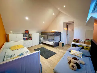 Un ou plusieurs lits dans un hébergement de l'établissement Maison familiale cosy & nature, Charolais