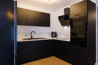 Cuisine ou kitchenette dans l'établissement Maison spacieuse au calme - parking privé - 8 personnes