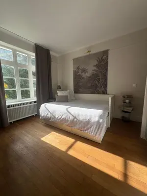 Un ou plusieurs lits dans un hébergement de l'établissement Suite studio Darcy